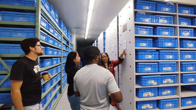 Consie Parducho tours participants inside the seed storage rooms at PGF